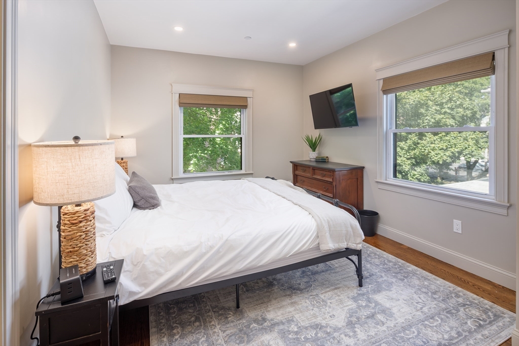 44 Winslow Road Brookline, MA 02446 - Photo 25 of 35 a bedroom with a bed tv and a window