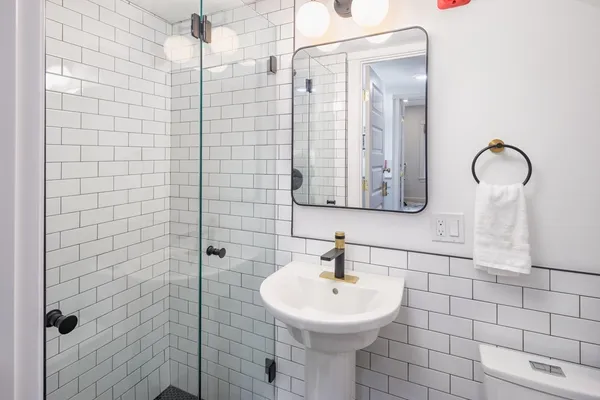 a bathroom with a sink and mirror