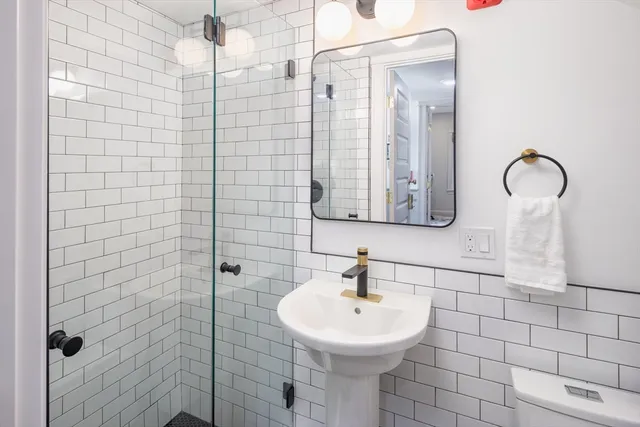 a bathroom with a sink and mirror