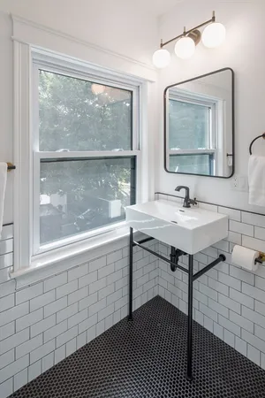 a bathroom with a sink and mirror