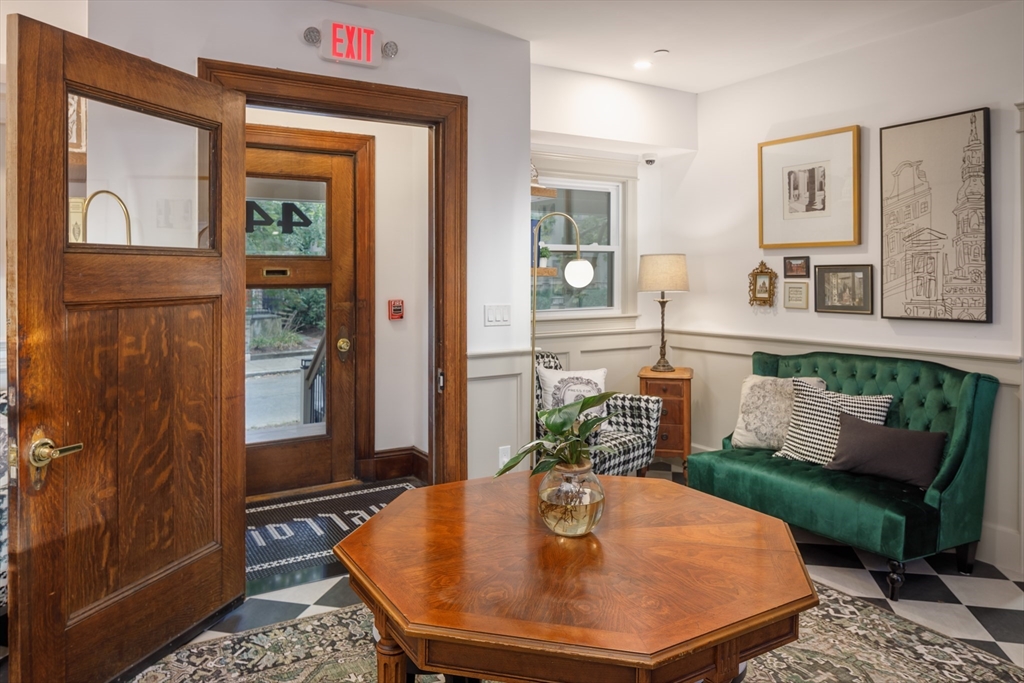 44 Winslow Road Brookline, MA 02446 - Photo 3 of 35 a living room with furniture and wooden floor