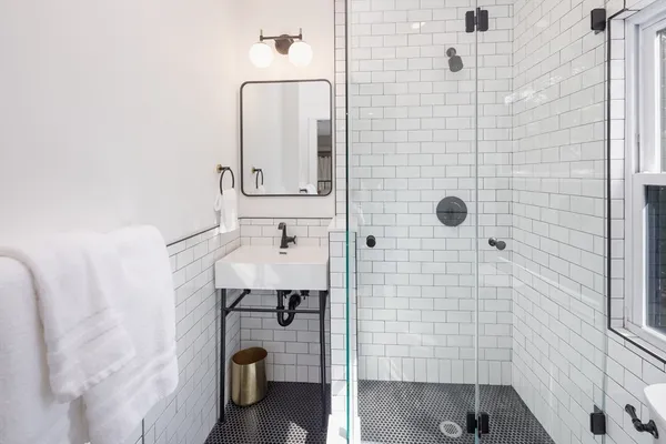 a living room with furniture wooden floor and a window