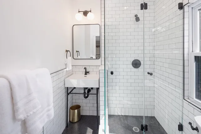 a living room with furniture wooden floor and a window