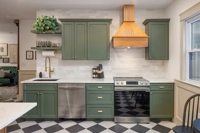 a kitchen with a sink stove and cabinets