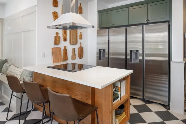 a kitchen with a table and chairs