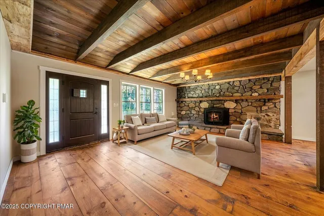 a bathroom with a toilet mirror vanity and a sink