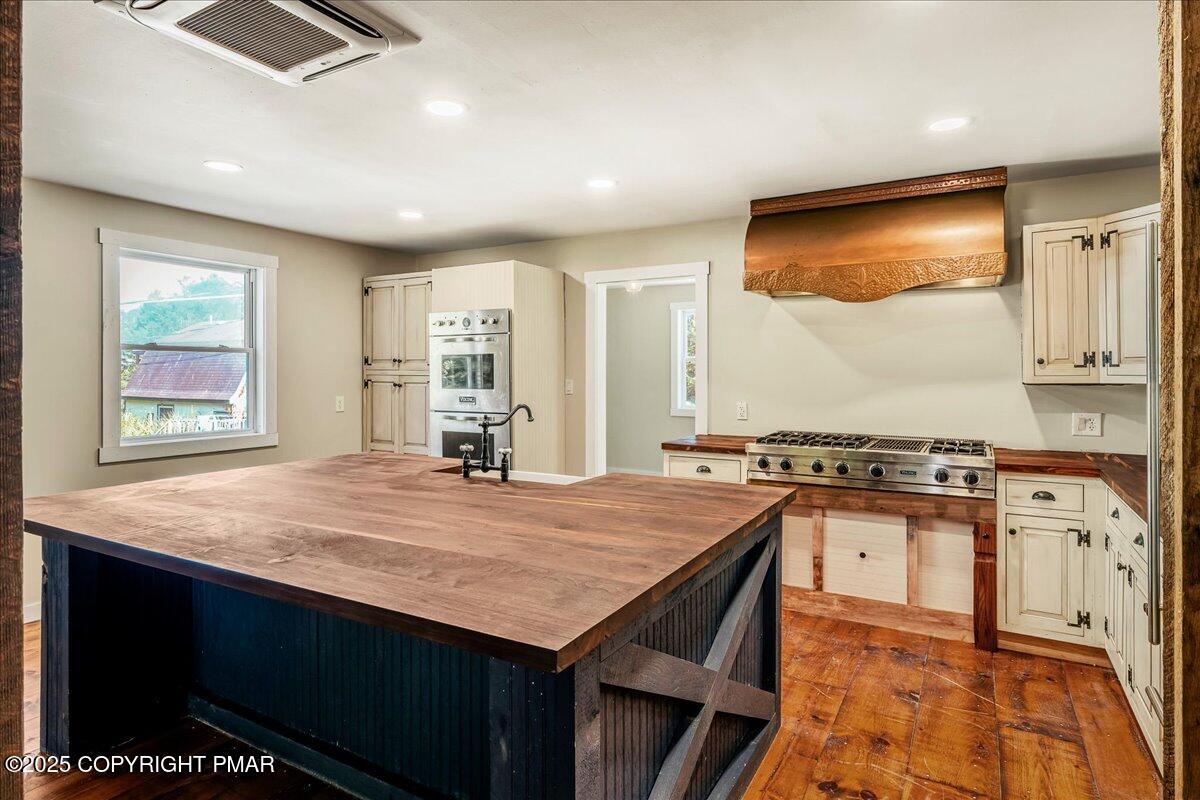 262 Lower Swiftwater Road Cresco, PA 18326 - Photo 16 of 50 a kitchen with stainless steel appliances granite countertop a stove a sink and a microwave