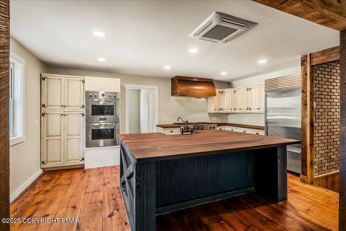 262 Lower Swiftwater Road Cresco, PA 18326 - Photo 18 of 50 a kitchen with kitchen island a sink appliances and cabinets