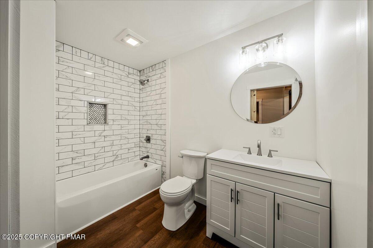 262 Lower Swiftwater Road Cresco, PA 18326 - Photo 28 of 50 a bathroom with a toilet mirror vanity and a sink