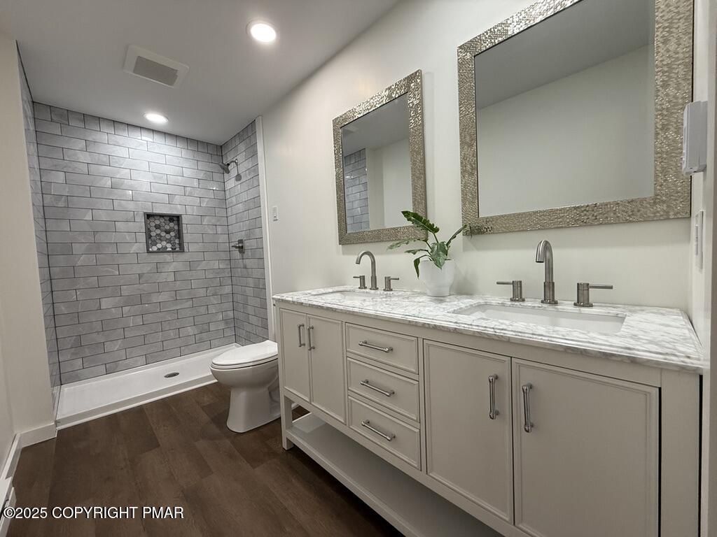 262 Lower Swiftwater Road Cresco, PA 18326 - Photo 35 of 50 a bathroom with a granite countertop sink toilet and shower