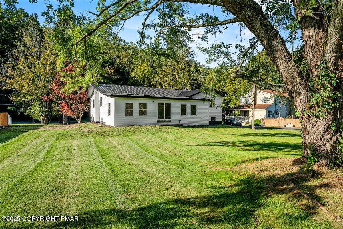262 Lower Swiftwater Road Cresco, PA 18326 - Photo 7 of 50 a house view with a garden space