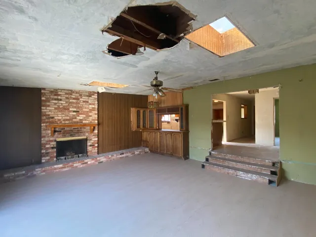 a backyard of a house with barbeque oven