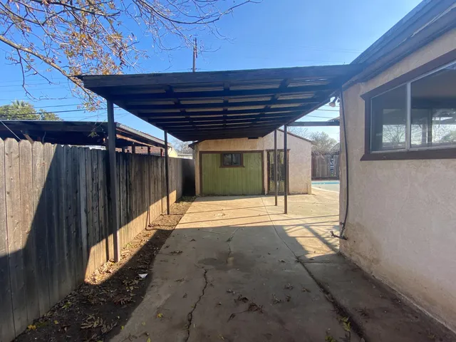 a bath room with a table and chairs