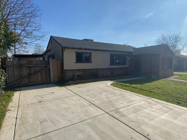 a house view with a backyard
