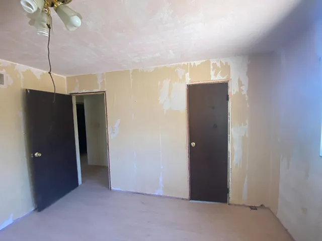 a view of empty room with closet