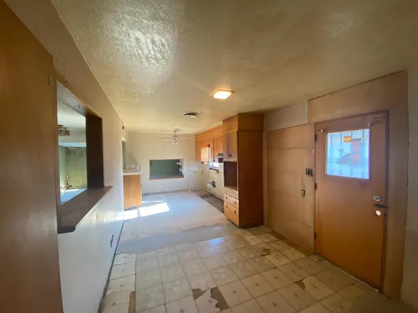 a view of hallway with livingroom and furniture