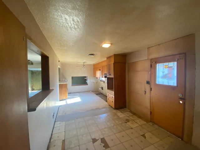 a view of hallway with livingroom and furniture