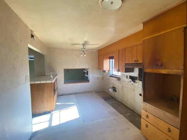 a bedroom with a bed and a mirror