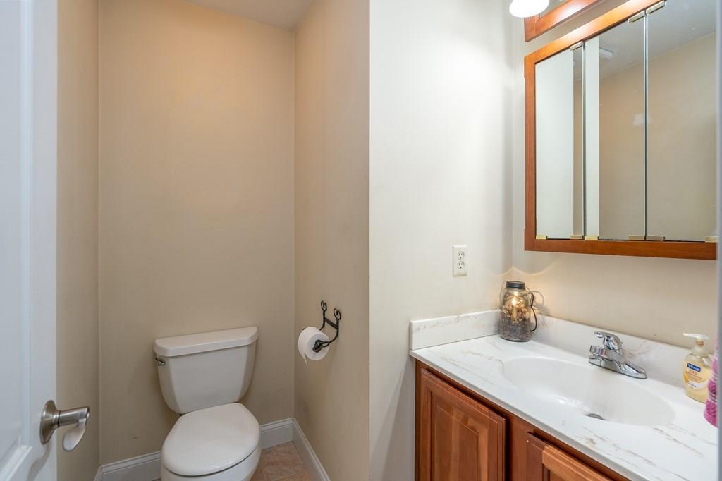 45 Gilbert Road Southampton, MA 01073 - Photo 11 of 36 a bathroom with a sink vanity mirror and toilet