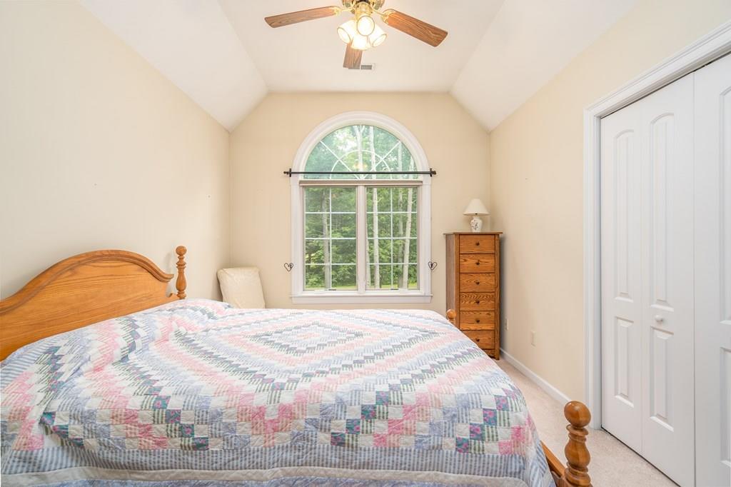 45 Gilbert Road Southampton, MA 01073 - Photo 16 of 36 a large bed sitting in a bedroom next to a window