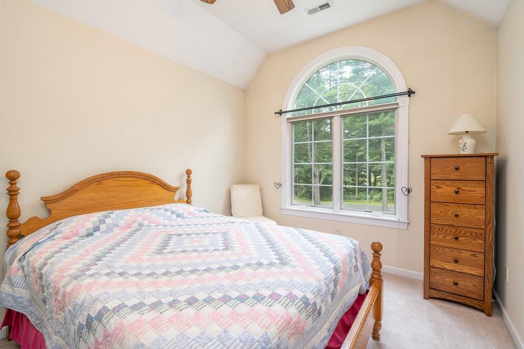 45 Gilbert Road Southampton, MA 01073 - Photo 17 of 36 a large bed sitting in a bedroom next to a window