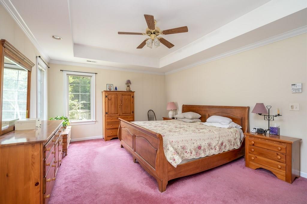 45 Gilbert Road Southampton, MA 01073 - Photo 18 of 36 a bedroom with a bed and a table with chair