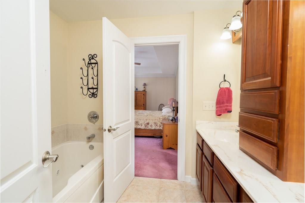45 Gilbert Road Southampton, MA 01073 - Photo 20 of 36 a bathroom with a bathtub and a shower