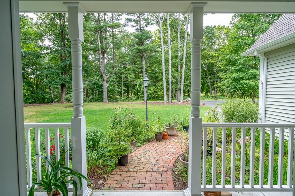 45 Gilbert Road Southampton, MA 01073 - Photo 3 of 36 a view of a chair and tables in the yard