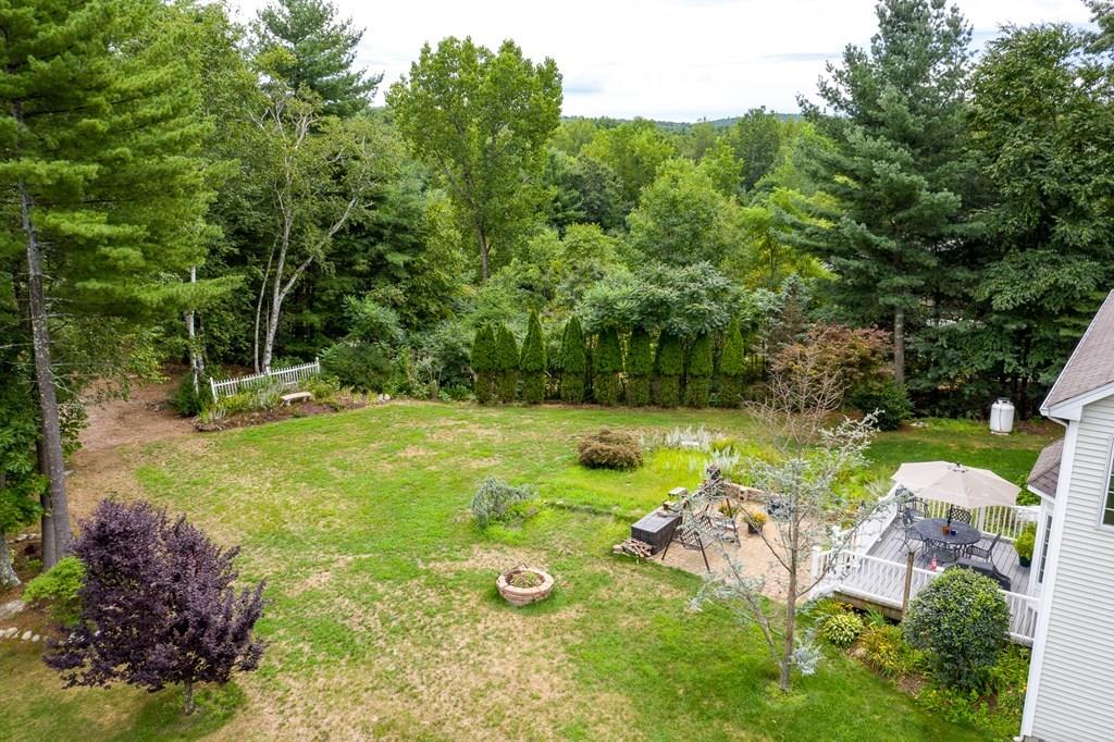 45 Gilbert Road Southampton, MA 01073 - Photo 32 of 36 a view of backyard with plants and outdoor seating