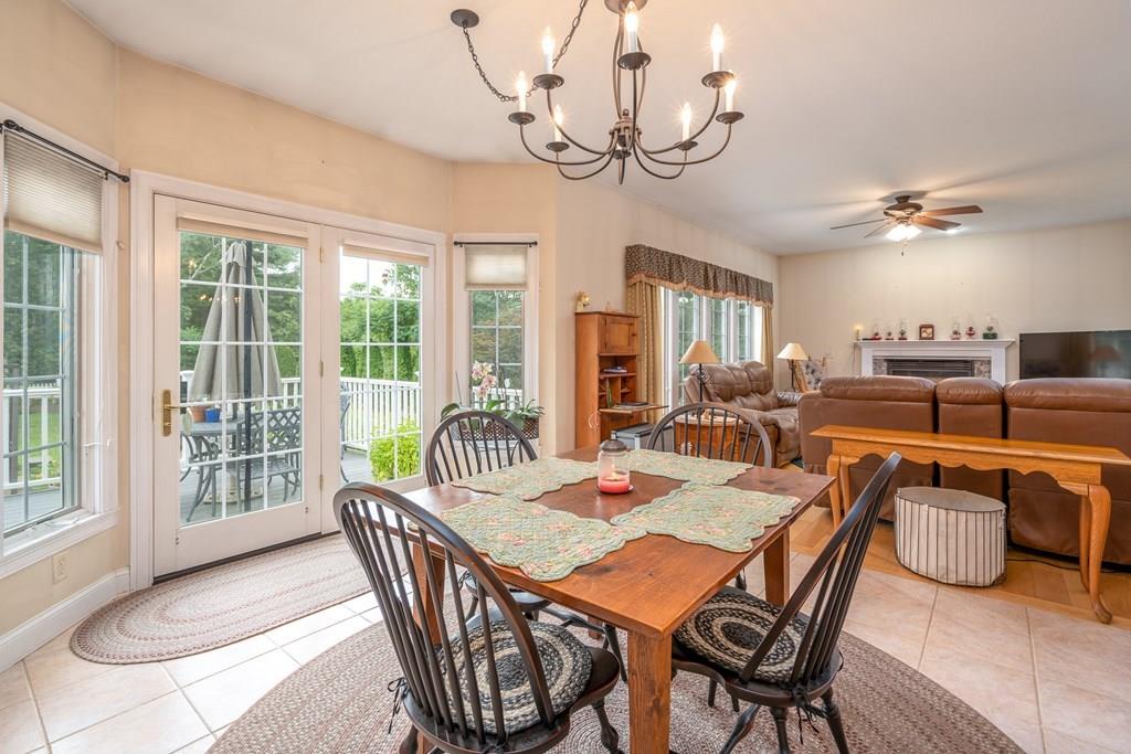 45 Gilbert Road Southampton, MA 01073 - Photo 4 of 36 a dining room with furniture a chandelier and wooden floor