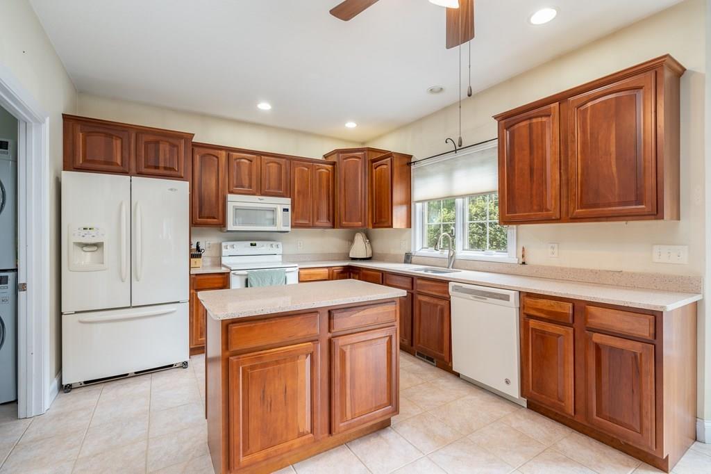 45 Gilbert Road Southampton, MA 01073 - Photo 8 of 36 a kitchen with stainless steel appliances granite countertop a refrigerator sink and cabinets