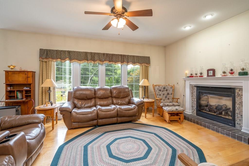 45 Gilbert Road Southampton, MA 01073 - Photo 9 of 36 a living room with furniture and a fireplace