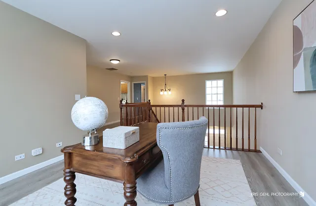 a view of a livingroom with furniture and wooden floor