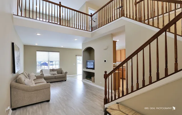 a view of livingroom with furniture stairs windows and stairs