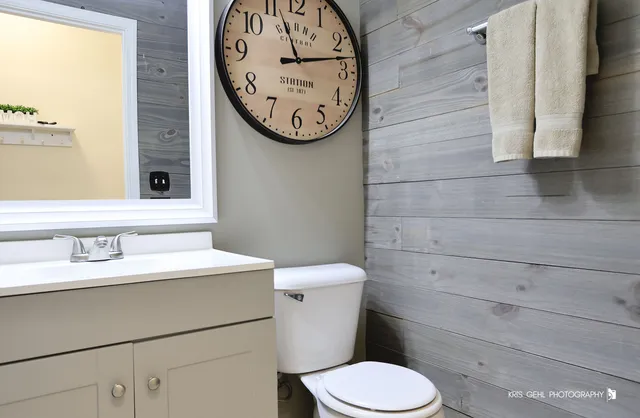 a bathroom with a toilet and a sink