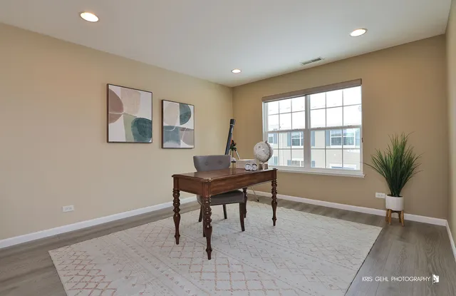 a workspace with furniture and a window