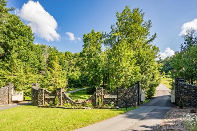 Lot 12 Cielo Road Blowing Rock, NC 28605 - Photo 9 of 14 a view of a yard with table and chairs and a large tree