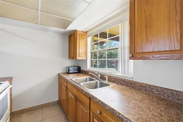 a kitchen with a sink and a window