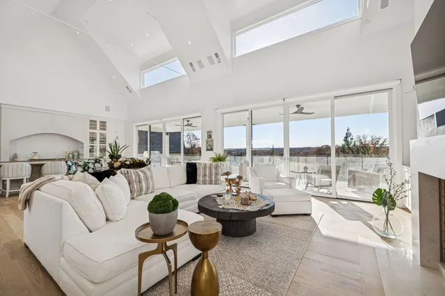 a living room with furniture and windows