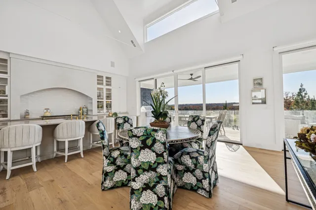 a view of room with furniture and wooden floor