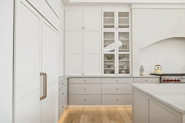 a spacious bedroom with a bed and a window