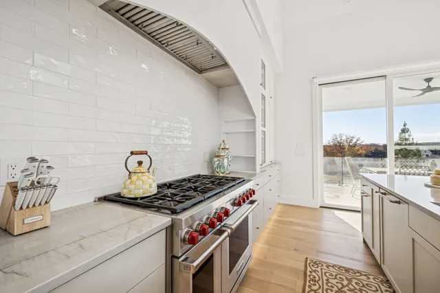 a bedroom with a bed couch and a flat screen tv