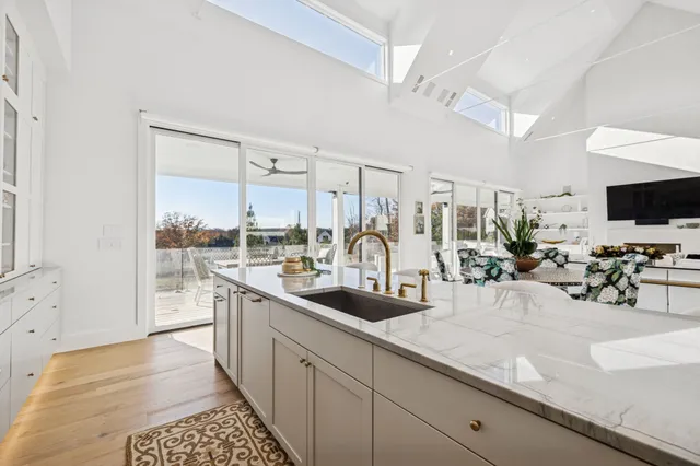 a spacious bedroom with a bed and a couch