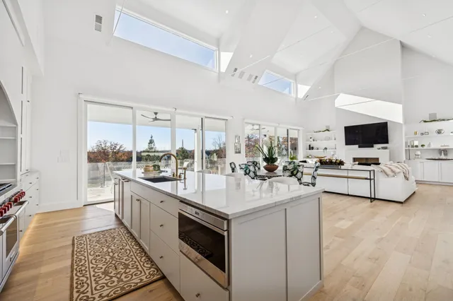 a living room with fireplace furniture and a flat screen tv