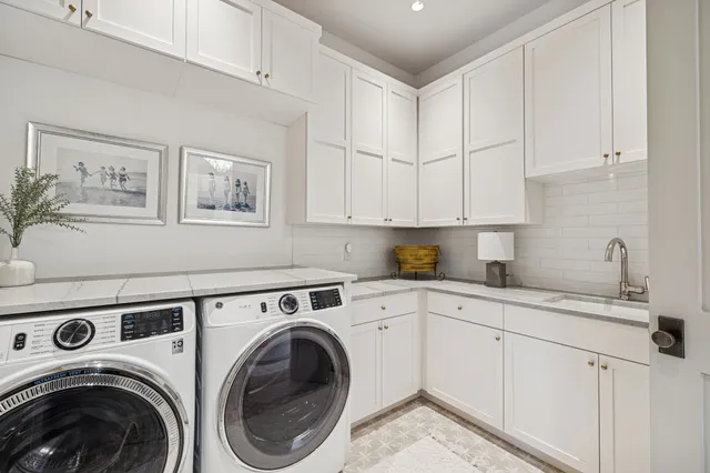 a bathroom with a sink a bathtub and a window