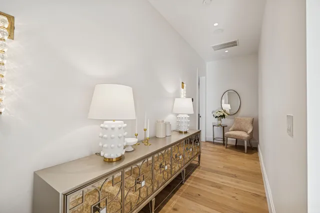 a view of entryway livingroom and hall with wooden floor