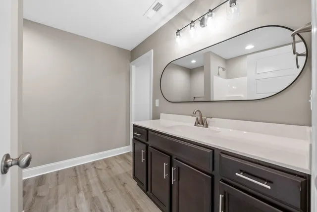 a bathroom with a sink and a mirror