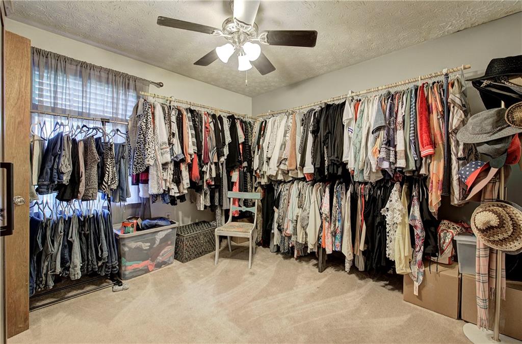3637 Nebo Road Hiram, GA 30141 - Photo 43 of 63 a view of walk in closet with clothes and shoes