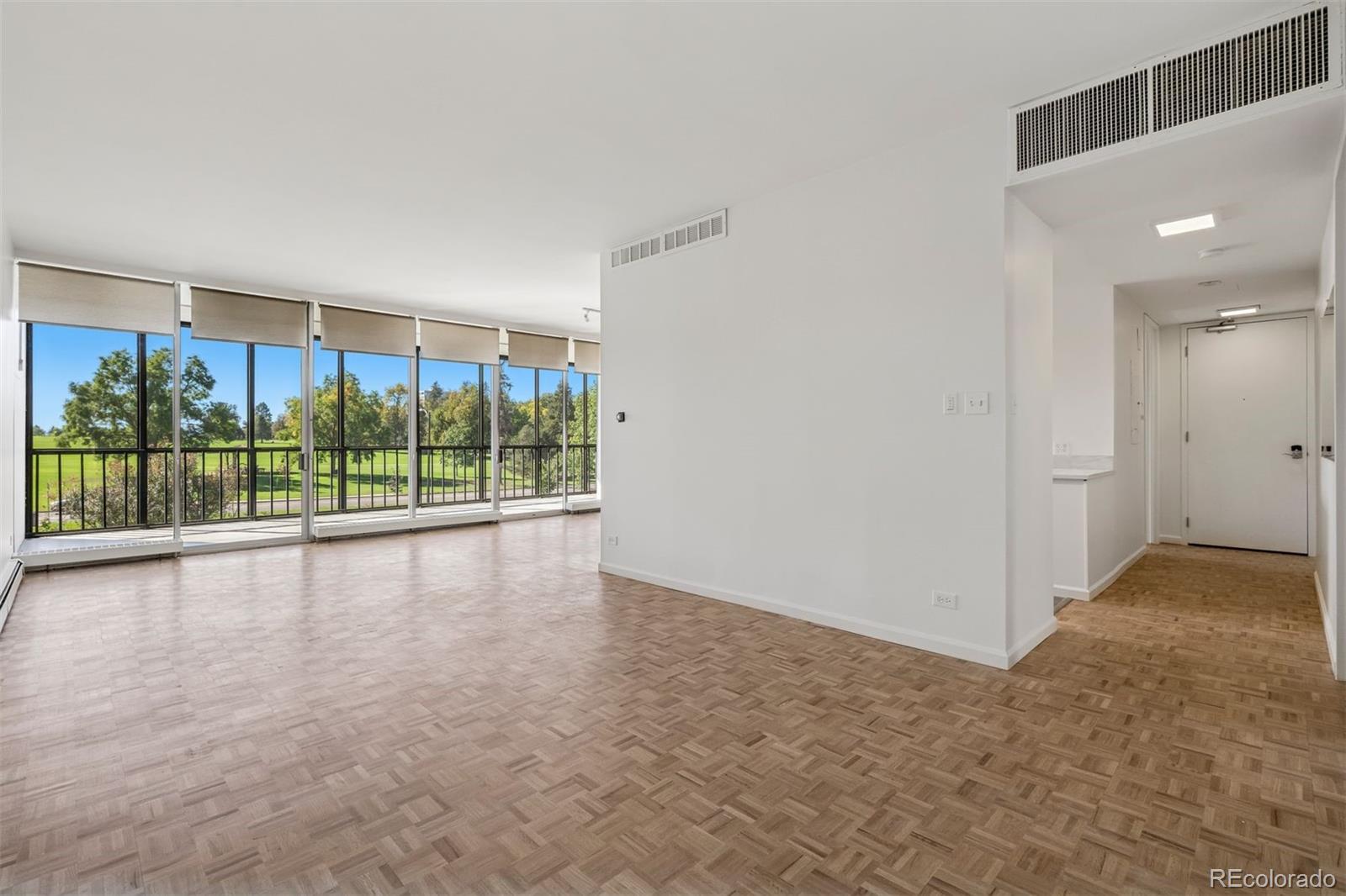 1201 North Williams Street, Unit 2A Denver, CO 80218 - Photo 13 of 29 wooden floor in an empty room with a window