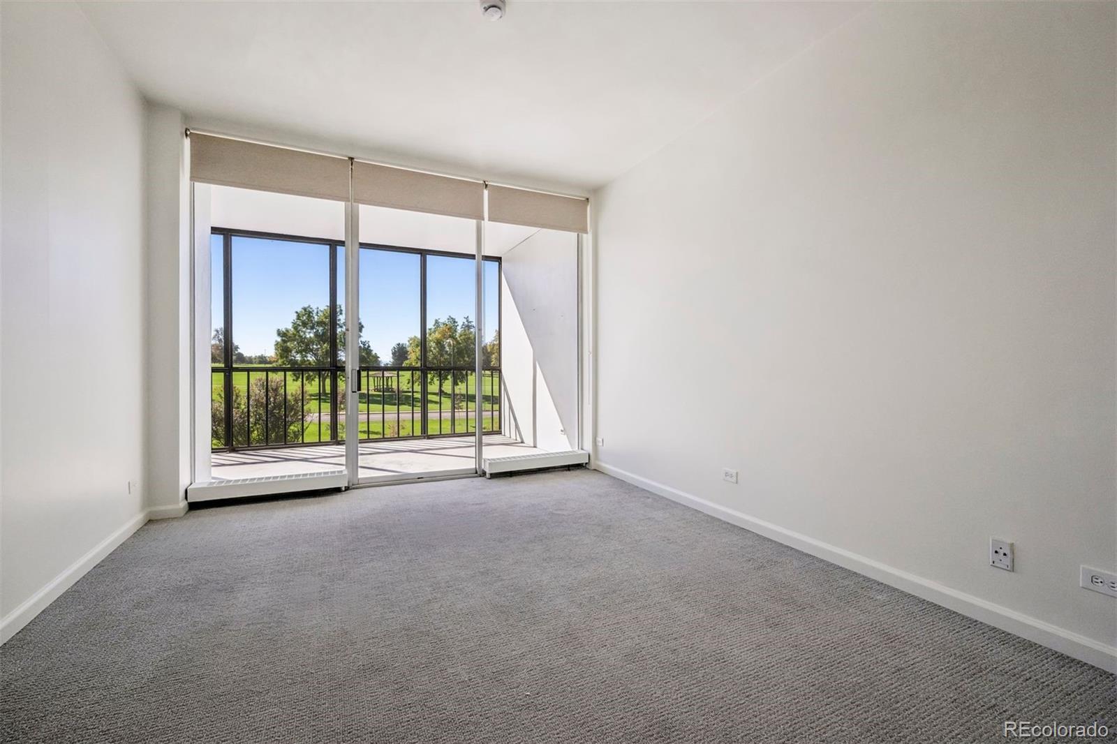 1201 North Williams Street, Unit 2A Denver, CO 80218 - Photo 14 of 29 a view of a room with a sliding door